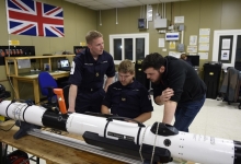 Members of the Royal Navy seen with the Iver unmanned underwater vehicle